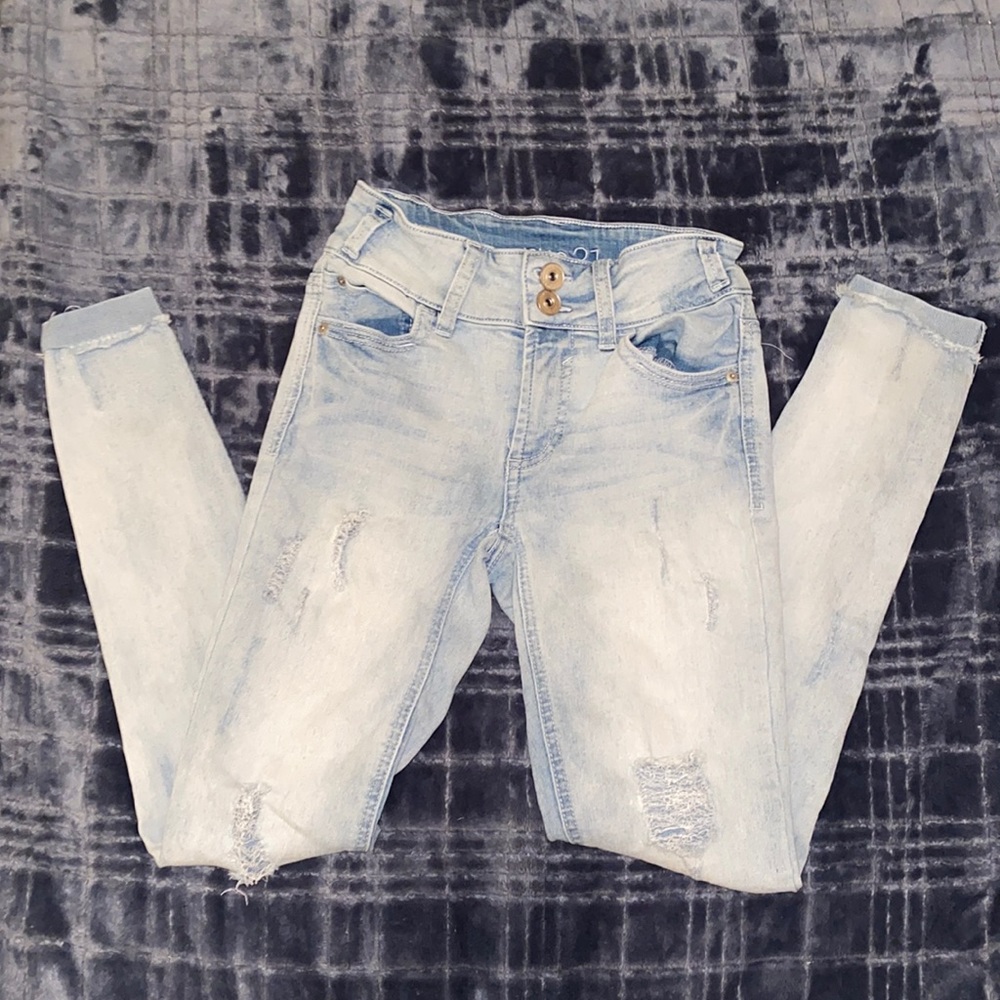 Ripped light jeans.